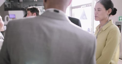 Group of Business Professionals Meeting and Shaking Hands