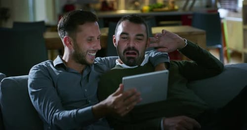 Authentic shot of young happy just married homosexual male gay couple in love enjoying time togeth