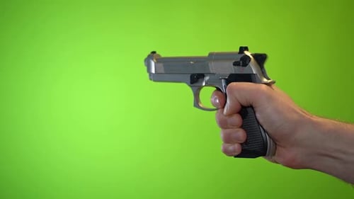 Pistol gun trigger firing recoil on green screen