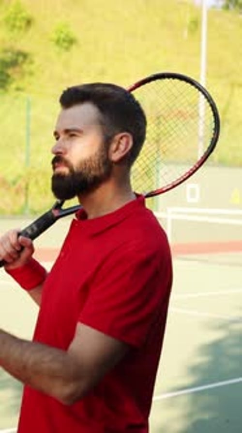 An Unwavering Tennis Player Fully Prepared and Eager for Competitive Action on the Court