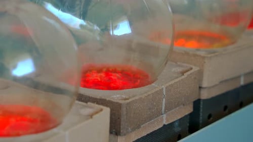 lighter with burner in test tubes inside the laboratory handling chemicals and solvents