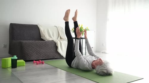 Senior Woman Exercising at Home