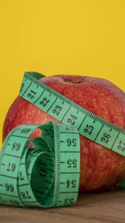 Apple with measuring tape