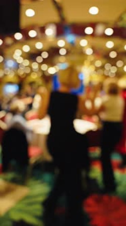 Footage of a Defocused Blurry Background Set in a Colorful and Vibrant Casino Atmosphere Full of