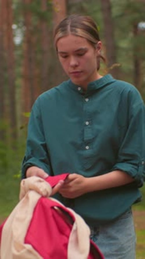 Young Hikers Walking Through Serene Forest