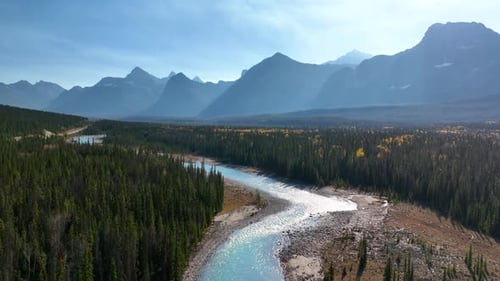 Canada. A drone view of the river in the mountains valley. An aerial view of river. Winding river.