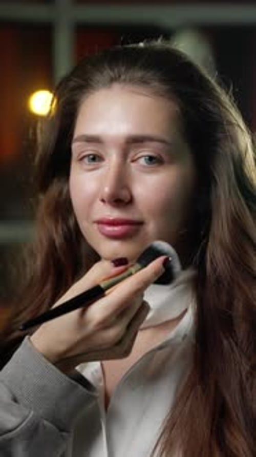 Woman Getting Makeup Applied with a Brush