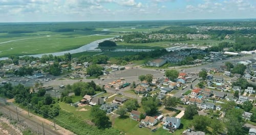 Scenic Overview of a Suburban Area with Waterways and Green Spaces During the Day