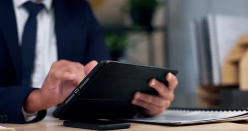 Businessman Uses Tablet Device in the Workplace