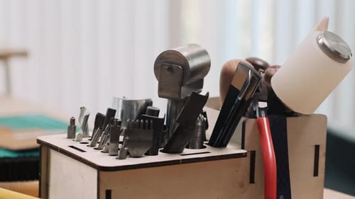 Table with Tools for Leather Craft in Workshop