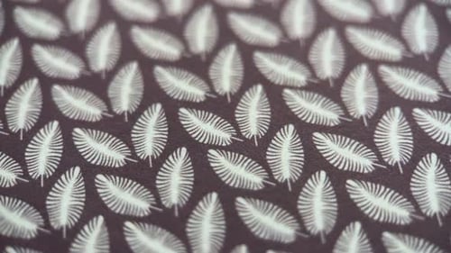 Brown Fabric with Repeating Frond Pattern Close Up