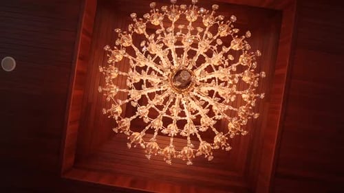 Beautiful Antique Crystal Chandelier under Wood Ceiling
