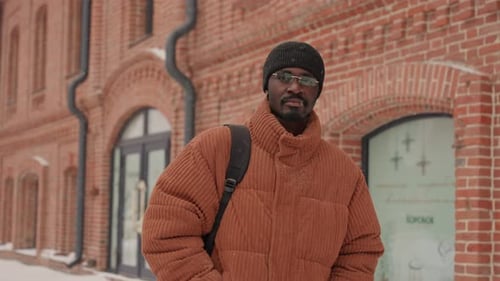 Person with Trendy Urban Attire Walks Through Brisk City Atmosphere Adventurous Man Dressed in