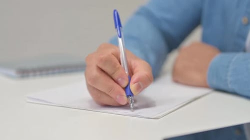 Close up of Man Writing a Letter