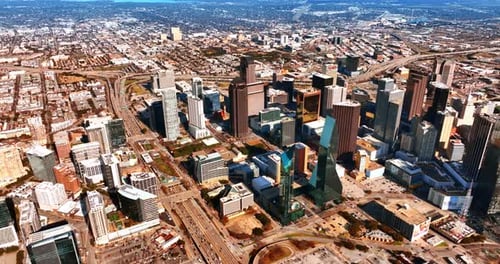 System of multilane highways going around the downtown with mighty skyscrapers. Panorama of Dallas