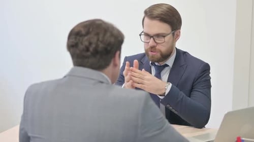 Confident Businessmen Having Talks in Office