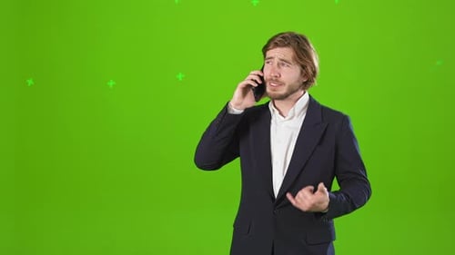 Busy Young Man Standing Working Talking on Phone