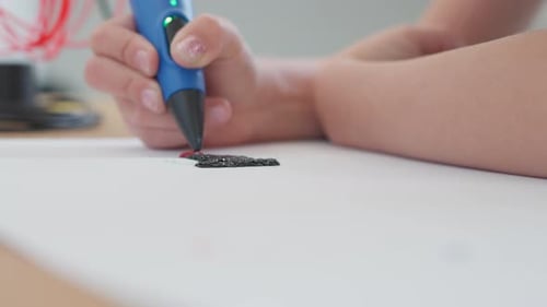 Child Creating Art with 3D Pen