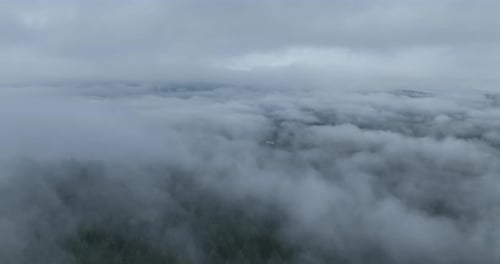 Aerial View of Clouds Filling a Valley