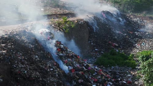 Burning Illegal Dump in Bali Pollution By Plastic Rubbish on Landfill in Asia