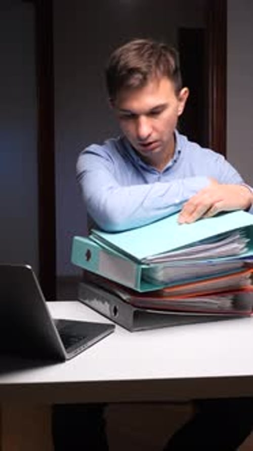 Vertical Video Tired Man Overwhelmed By Office Paperwork Deadline