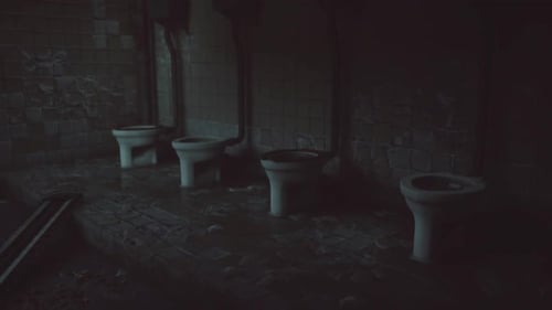 Toilette mit mehreren Kabinen in einer modernen Umgebung bei Tageslicht