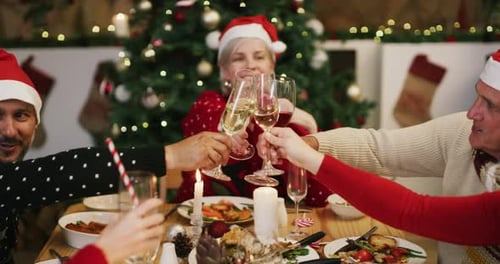 Family Cheers Champagne at Christmas Dinner