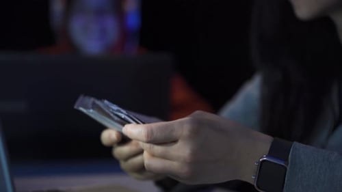 Profitable hacker counting money.