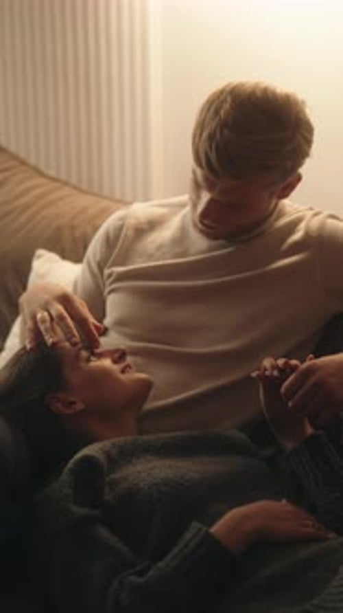 Loving Couple Relaxing Together at Home