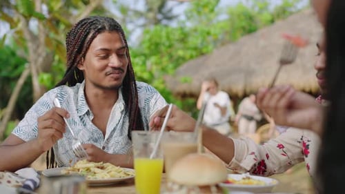 Multicultural Friends Laugh Eat at Sunny Outdoor Cafe LGBTQ Group Enjoys Brunch Conversation Diverse