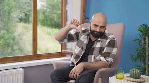 Man looking negative at camera. Negative-looking man.