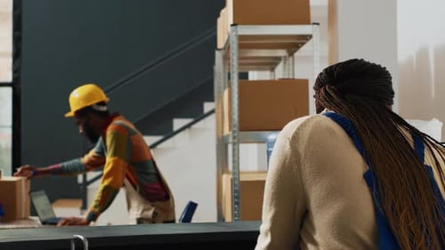 Retail Workers Checking Packages of Supplies in Depot