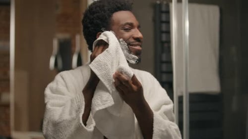 Man Drying Face with Towel After Shaving