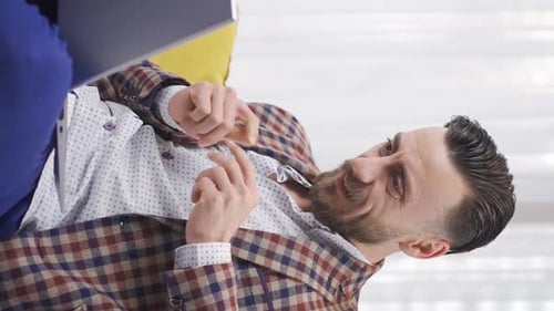 Man Typing on Laptop While Sitting on Couch