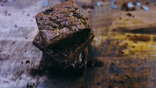 Delicious Chocolate Brownies Stacked High on Wood Surface