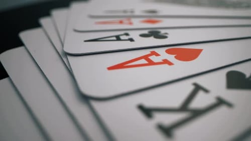 Playing Cards Spread on Dark Table - Casino Stock Footage