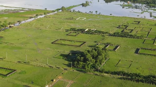 Aerial view of real estate property land plot affected by flood water