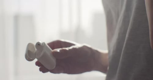 Close Up of Wireless Earbuds and Charging Case