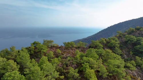 Camera Slowly Pans to the Right Revealing a Beautiful Mediterranean Coastline with Turquoise Waters