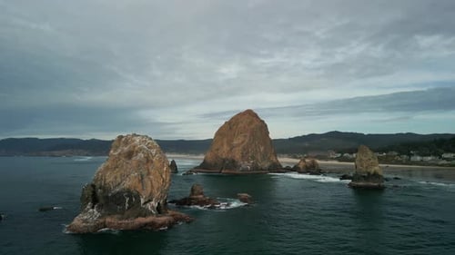 Aerial Shot of Haystack Rock Beach in Coastal Town Cannon Beach Oregon