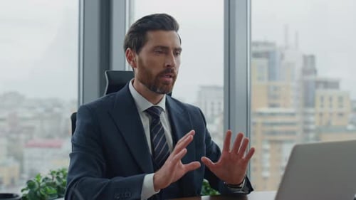 Handsome Bearded Manager Consulting Using Online Call At Laptop Sitting Office Desk Close Up. Con...