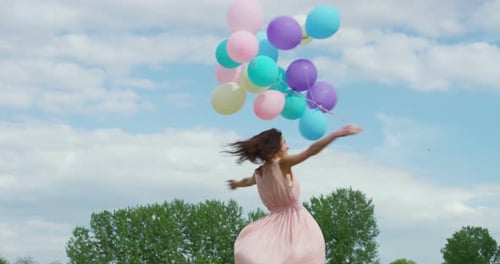 Happy Girl Twirling with Balloons in Spring Field