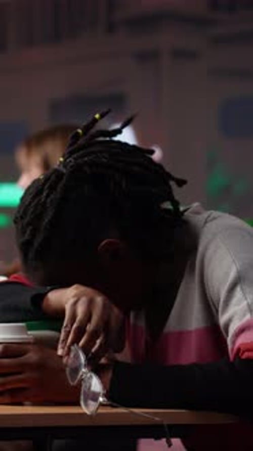 Vertical Video Young Adult Wakes Up Black Student in University Library After Falling Asleep
