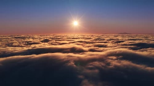 Aerial View Above Clouds at Sunset or Sunrise