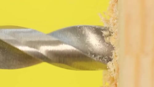 Drill Bit Drilling Into Wood, Close Up