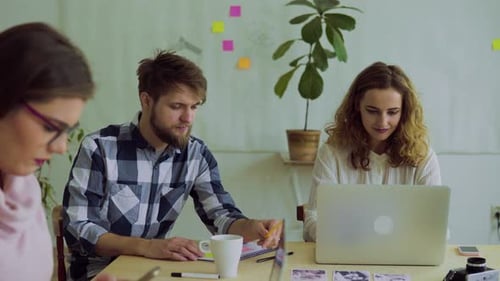 Group of Young People Working Together in an Office