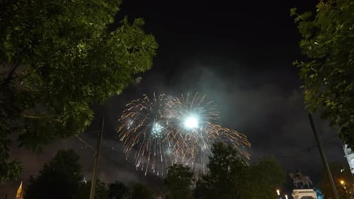 Bottom Angle View Fireworks in Darkness on Sky in Urban European City