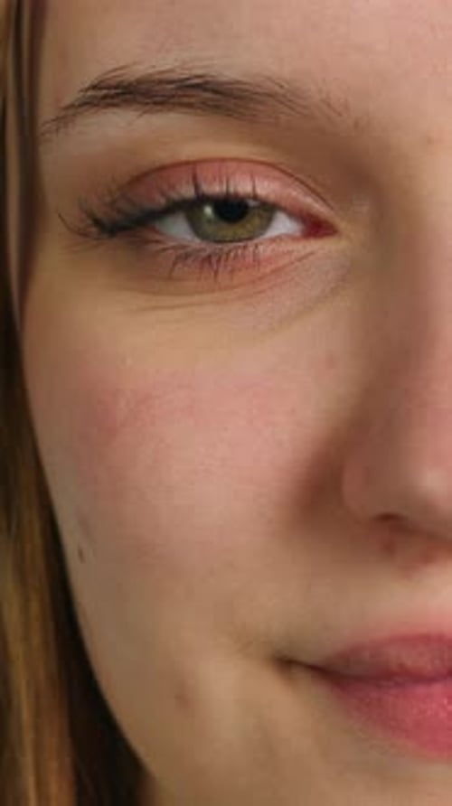Close-up of Woman's Eye Blinking and Smiling