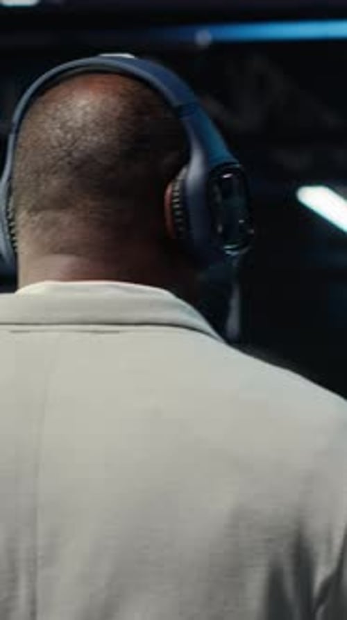 Vertical Video Software Developer in Data Center Workspace Coding on Tablet