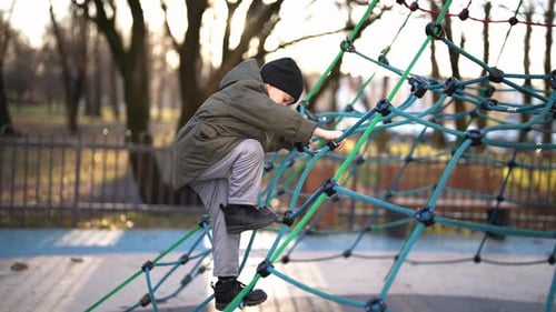 Happy Child Playing in Playground